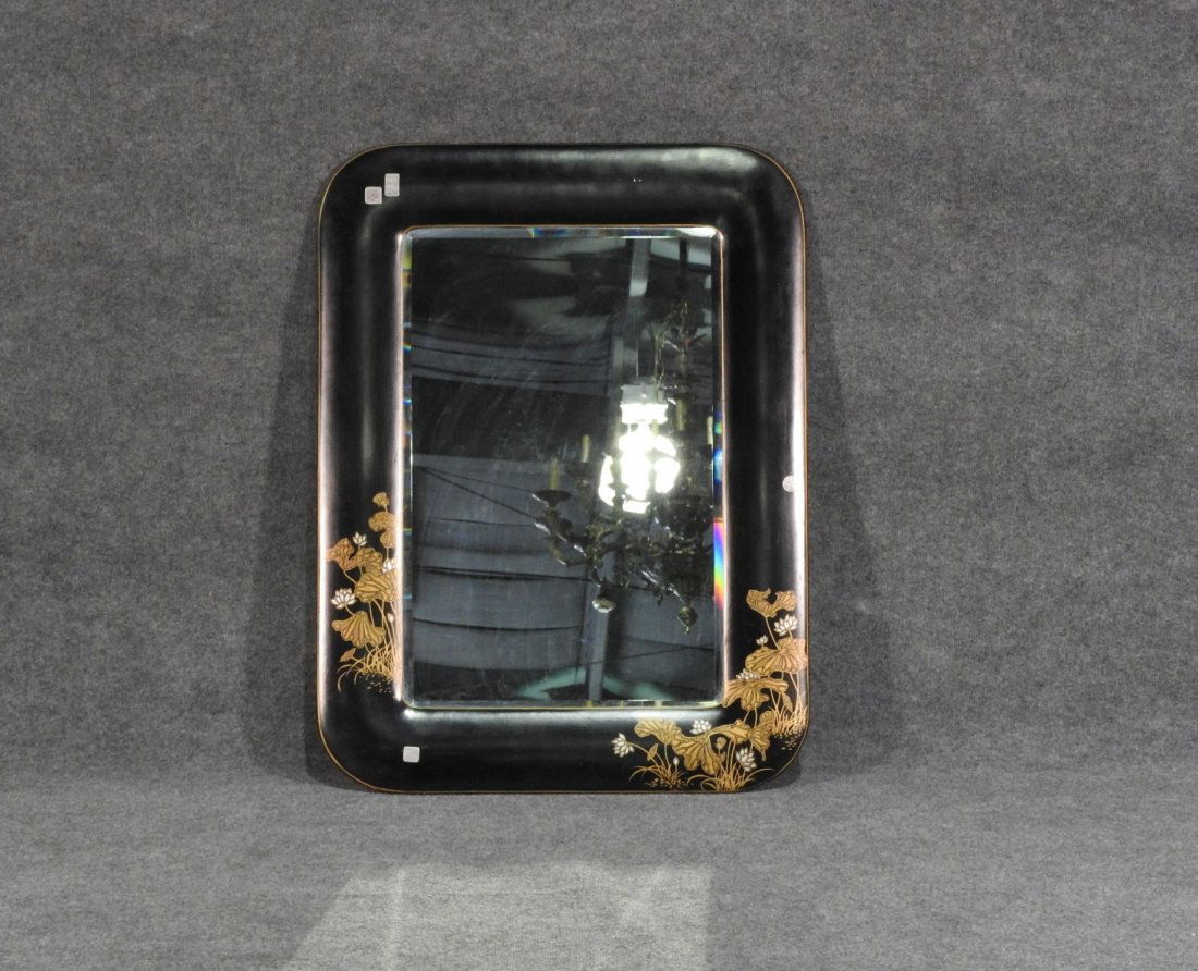 CHINOSERIE STYLE EBONIZED MIRROR: Floral designs. Ebonized w gilt trim. H:39 1/2in W: 30in D: 3/4in