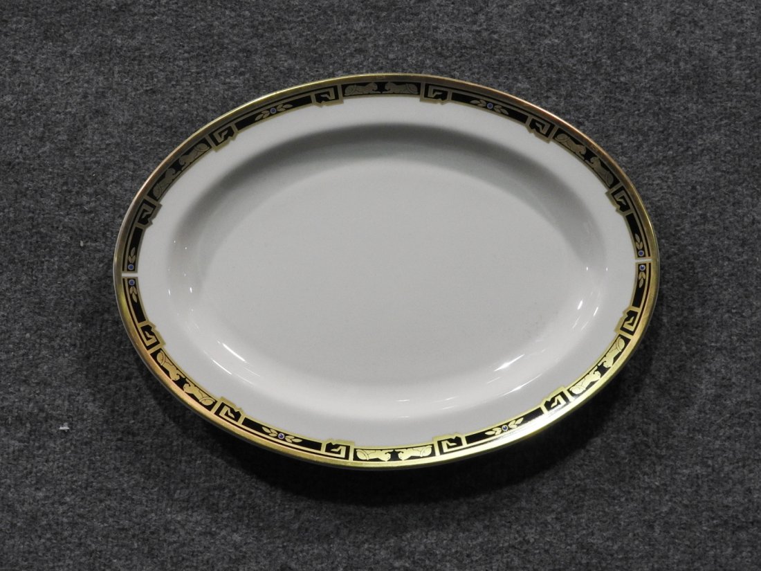 CARTIER PANTHER AND GOLD DECORATED PLATTER: Gilt trim with motif panthers. H: W: D: