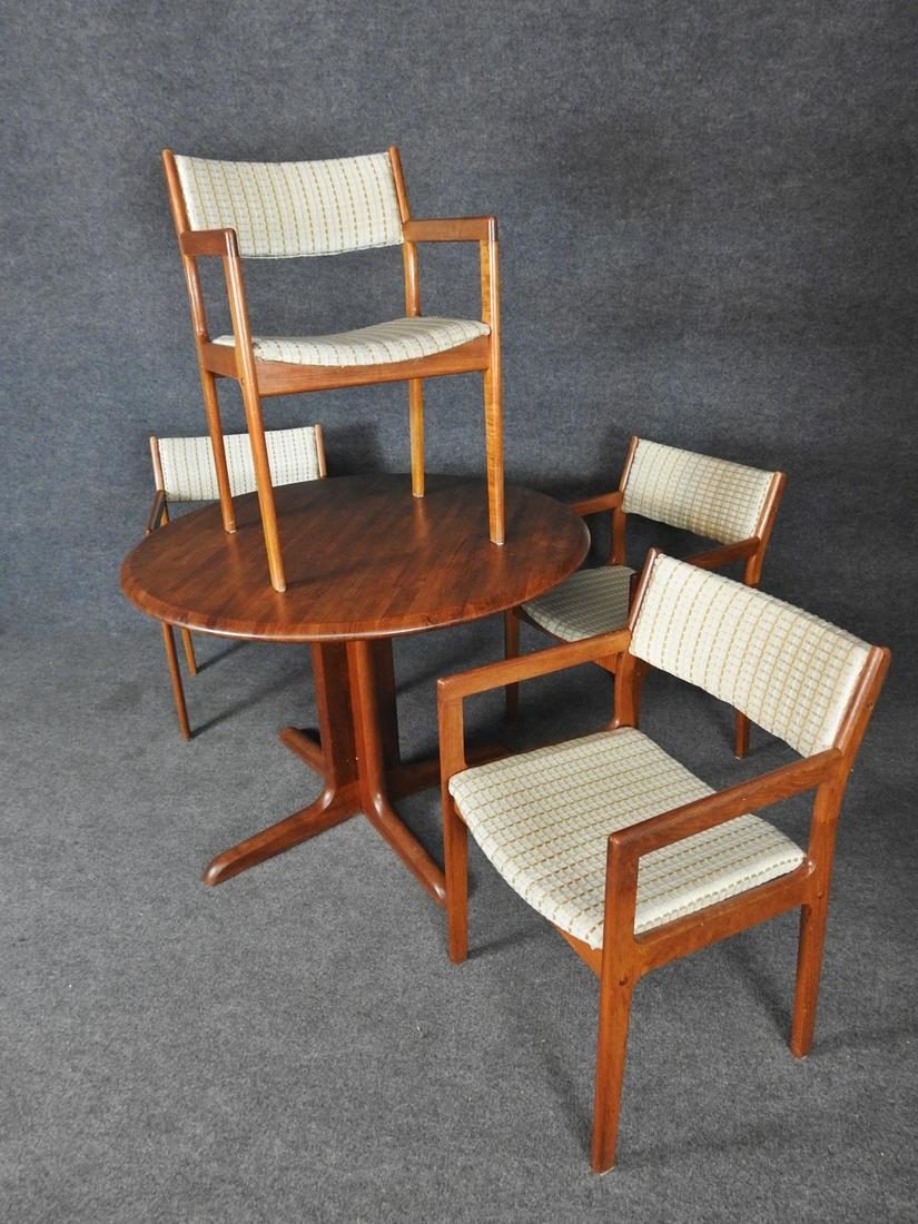 5pc. DANISH TEAK DINING SET: 4 arm chairs with plaid covering. Teak frames. Table has teak butcher block top. Table: 29"h. x 42"diam. Chairs: 31"h. x 20 1/4"w. x 21"d. Seat height: 17"h.