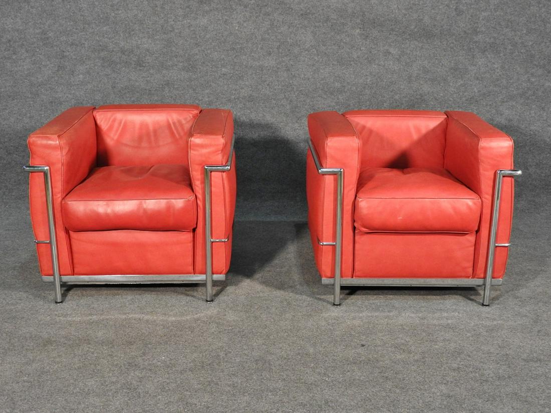 PAIR LC3 STYLE CHAIRS ATTR LE CORBUSIER: Chrome frames. Leather upholstery. 27" h x 30 1/4" w x 28" d. Seat height 19".