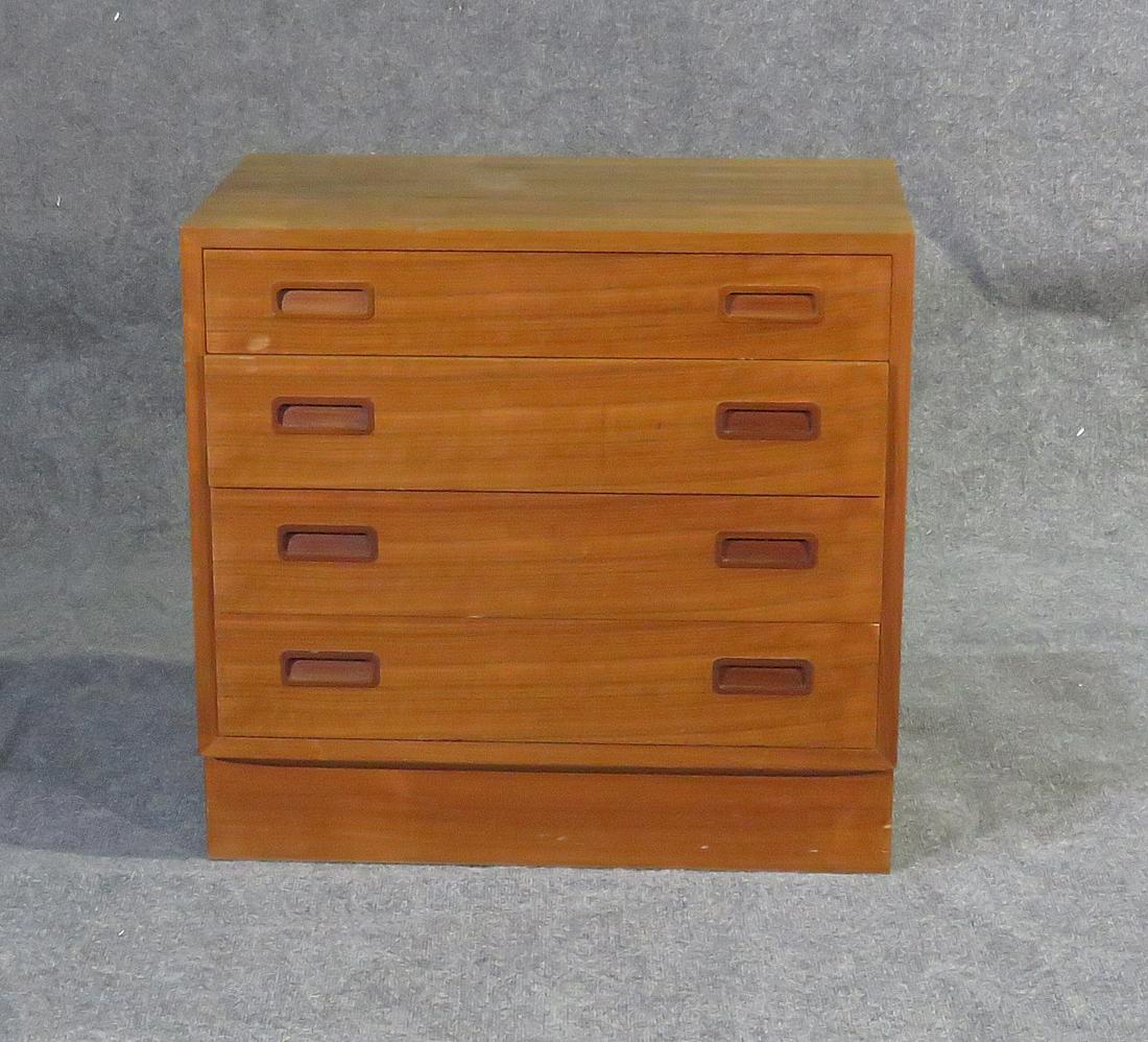 MAURICE VILLENCIA NIGHTSTAND: Walnut. 4 dovetailed drawers. 26 1/4" h x 27 5/8" w x 16 3/4" d.