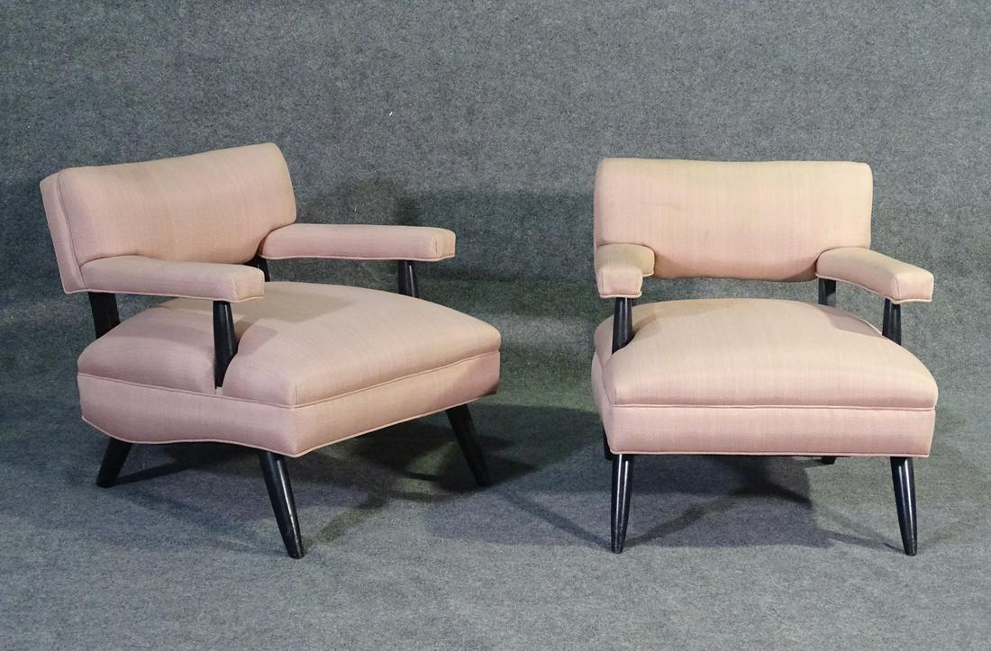 PAIR PAUL LASZLO STYLE LOUNGE CHAIRS: Ebonized frame. Pink upholstery. 27 1/2" h x 26" w x 32 1/2" d. Seat height 17".