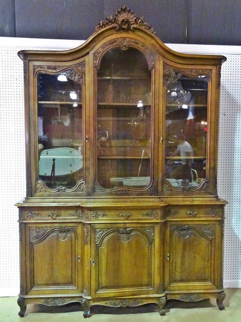 2 PC FRENCH CARVED CHINA: Top piece has 3 glass doors and 2 shelves. Bottom has 3 dovetailed drawers. Also has 3 doors. Center door contains 5 pull out lined drawers. Metal hardware. 103 1/2" h x 74" w x 21 1/4" d.