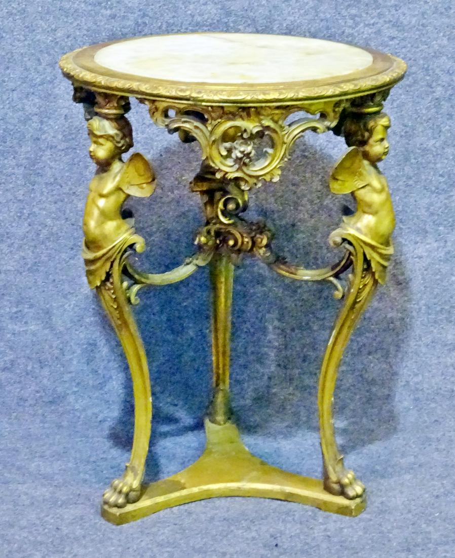 LOUIS XVI STYLE GUERIDON: Inset onyx top. Gilded wood frame. Figural. Claw feet. 29 5/8" h x 21 7/8" diameter.