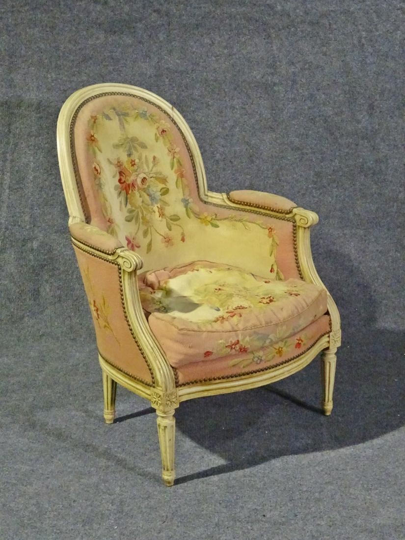LOUIS XV STYLE BERGERE W NEEDLEPOINT: With needlepoint upholstery. Painted carved wood frame. 38" h x 26 3/4" w x 30 1/4" d. Seat height 17 1/4"