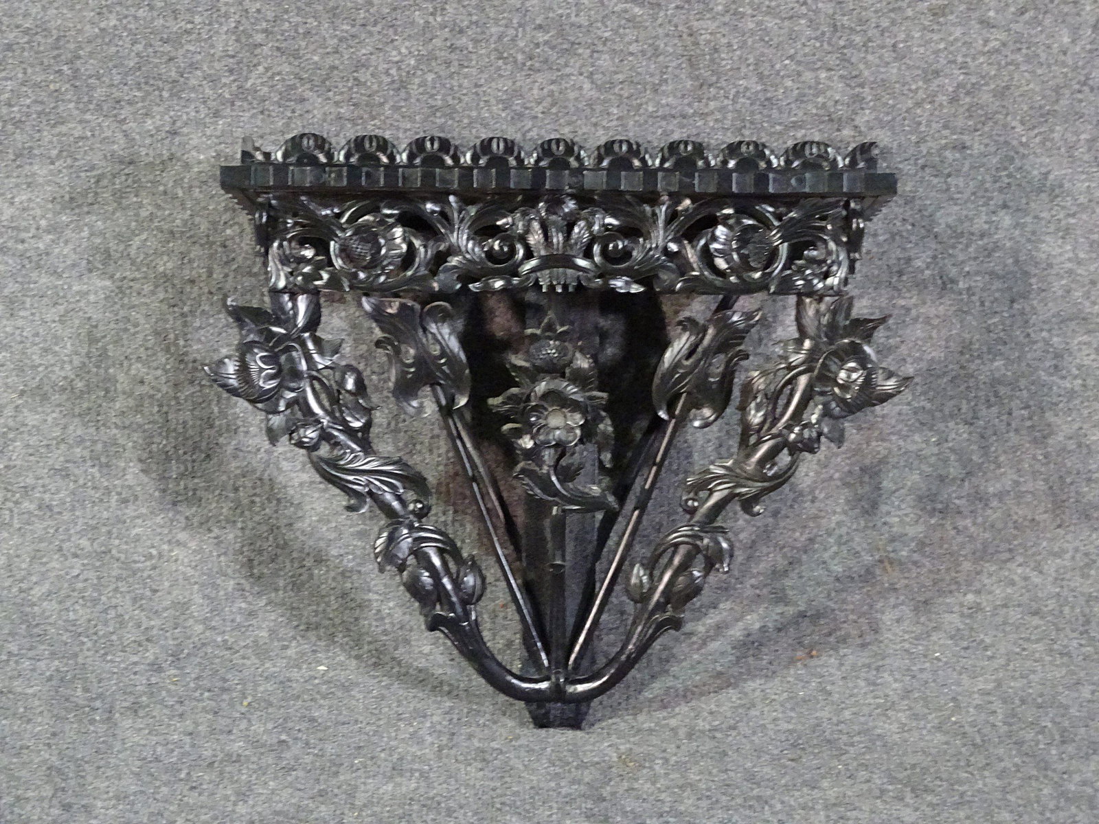 EBONIZED ASIAN HARDWOOD WALL BRACKET: Carved ebonized wood. 18" h x 20 3/4" w x 6 1/2" d.