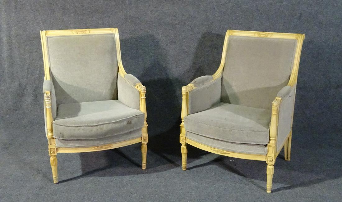 PAIR LOUIS XVI STYLE ARM CHAIRS: Carved wood frames. Upholstered. 35 1/2" h x 26" w x 30" d. Seat height 17".