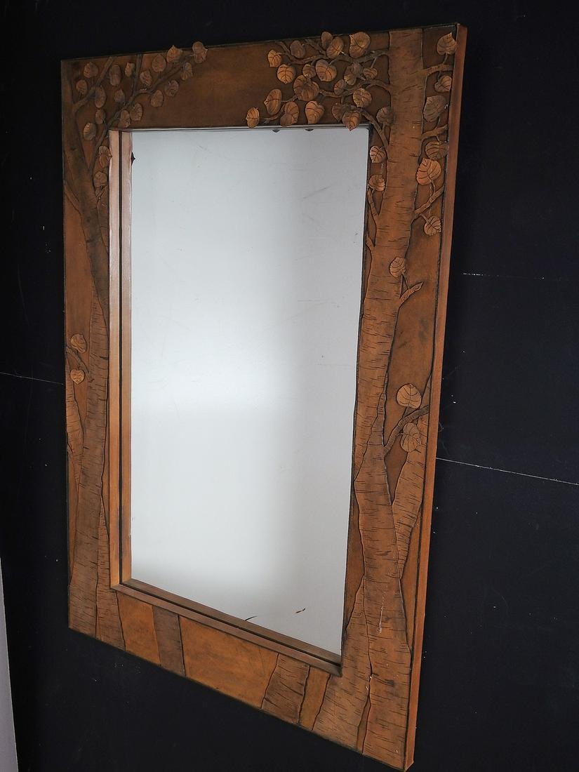 LEATHER STUDIO LEAF & BRANCH MIRROR: All hand crafted studio made mirror with insert mirror. 47 1/2" h x 32 1/2" w x1 1/4" d.