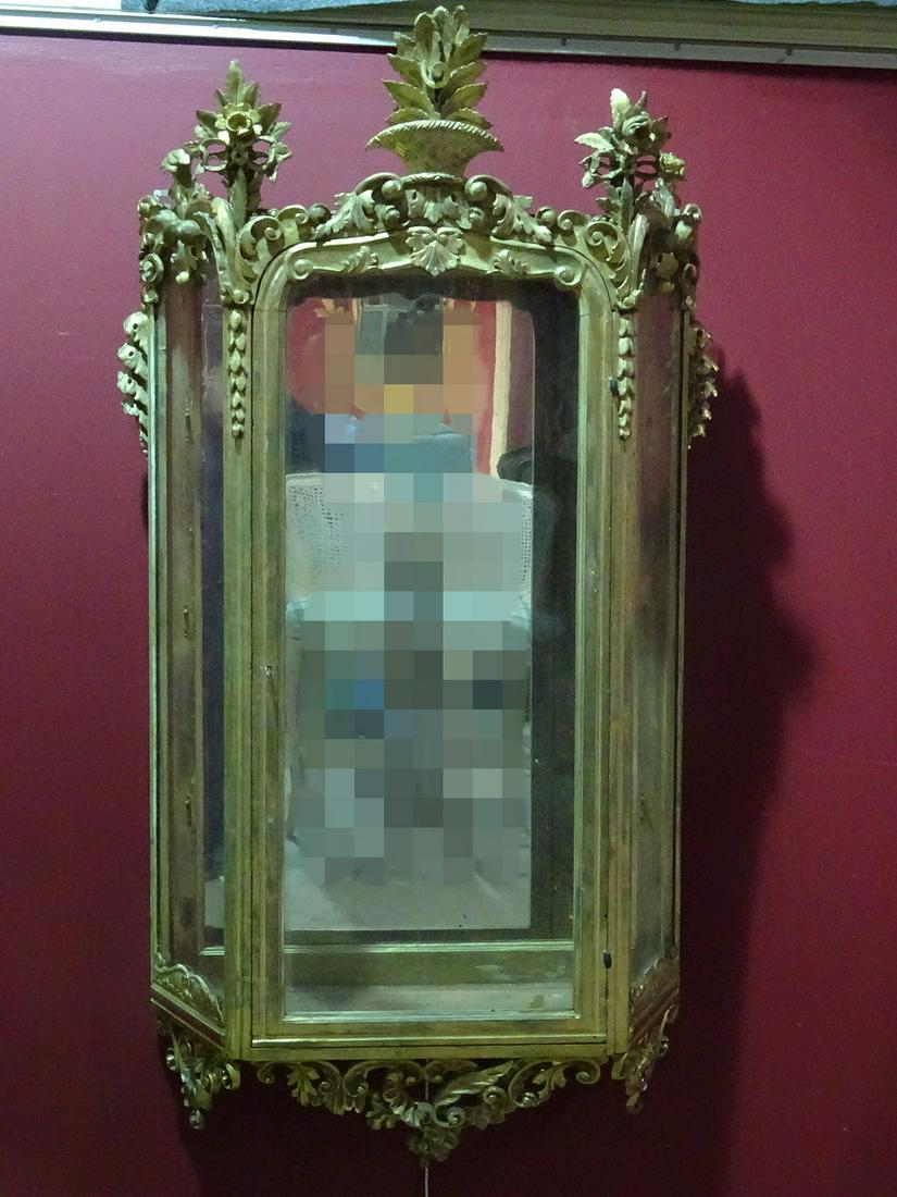 ANTIQUE GILT FRENCH HANGING CURIO: Glass shelves. Mirrored back. Gilt painted. Carved. 61" h x 33 1/2" w x 10 3/4" d.