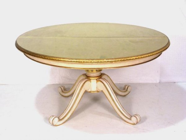 56" ROUND GOLD MIRRORED TOP TABLE: Distressed paint and gilt. Two piece gilt glass top. Excellent condition. 29 1/2"h. x 56 1/2" diameter.