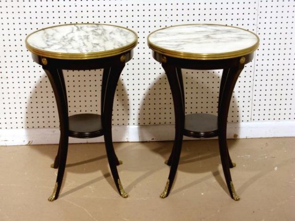 Pr. JANSEN EBONIZED MARBLETOP TABLES: Bronze trimmed marble tops. Bronze claw feet and rosettes. Very good condition. 25 1/2"h. x 17 1/2" diameter.
