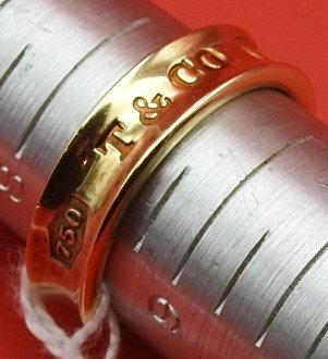 18KT GOLD RING TIFFANY & CO.: 1837. Commemorative gold ring of company founding. Approximate 8.5 size. 5.5 DWT.