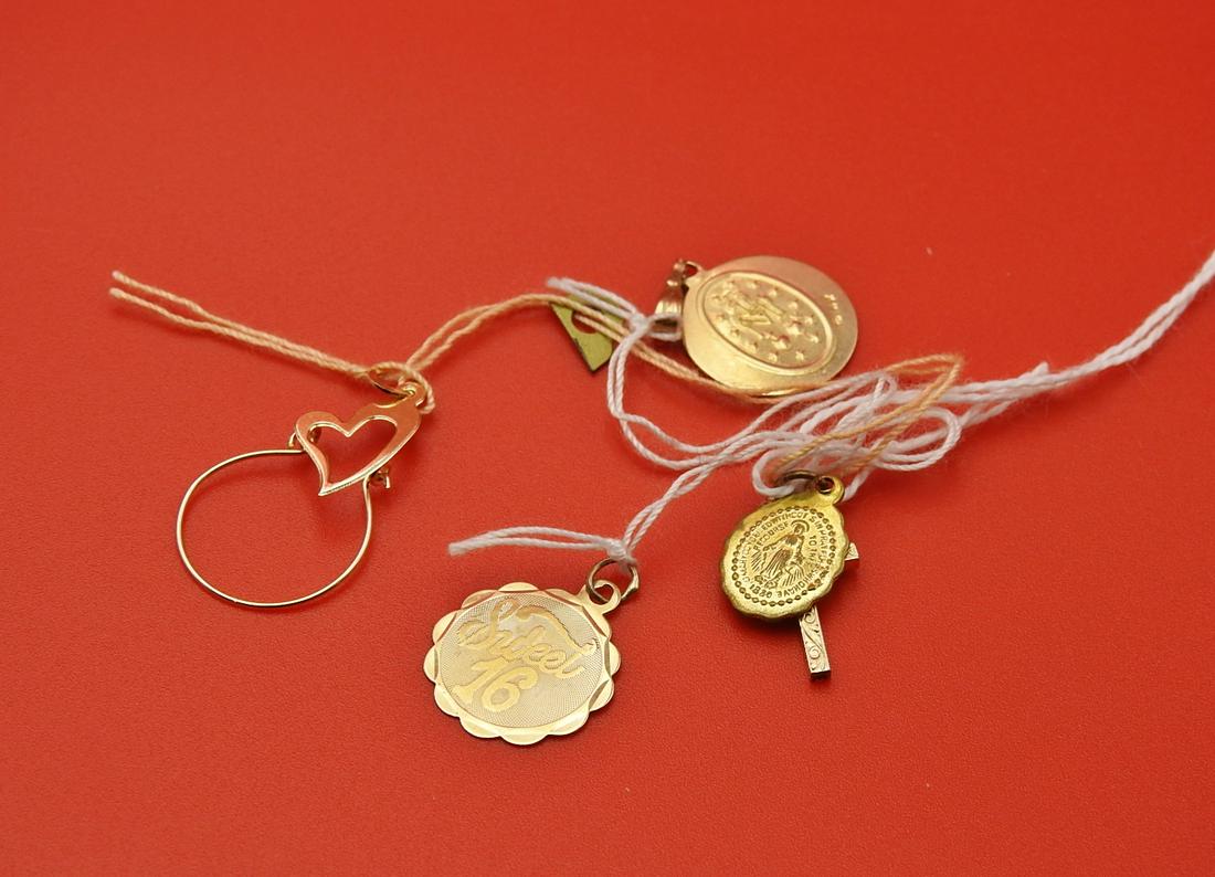 4 - 14KT GOLD PENDANTS: Two religious metals. One sweet sixteen. One heart and circle. 2 DWT.