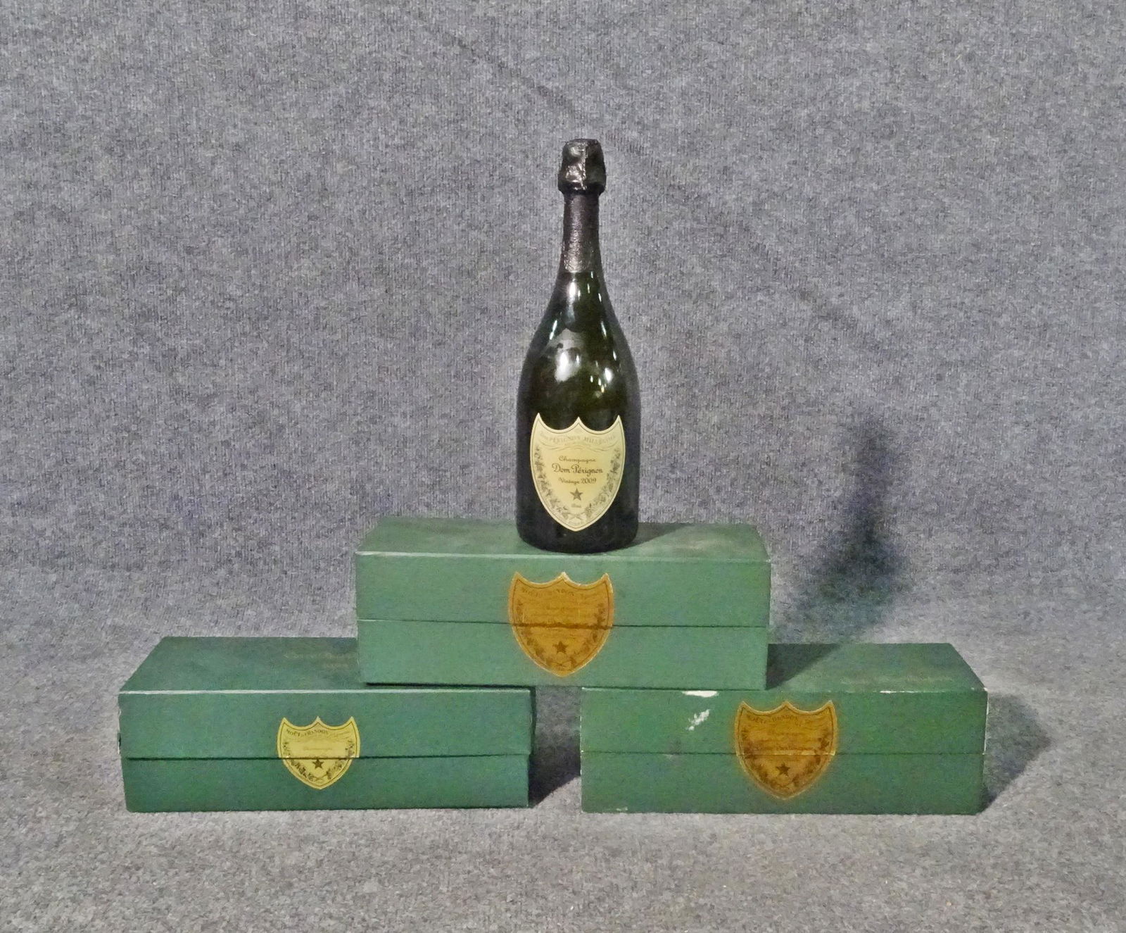 4 BOTTLES DOM PERIGNON: Vintage various years: 2009, 1982, 1983, 1985. 750 ml. One box still sealed. 12" h x 3 3/4" diameter.