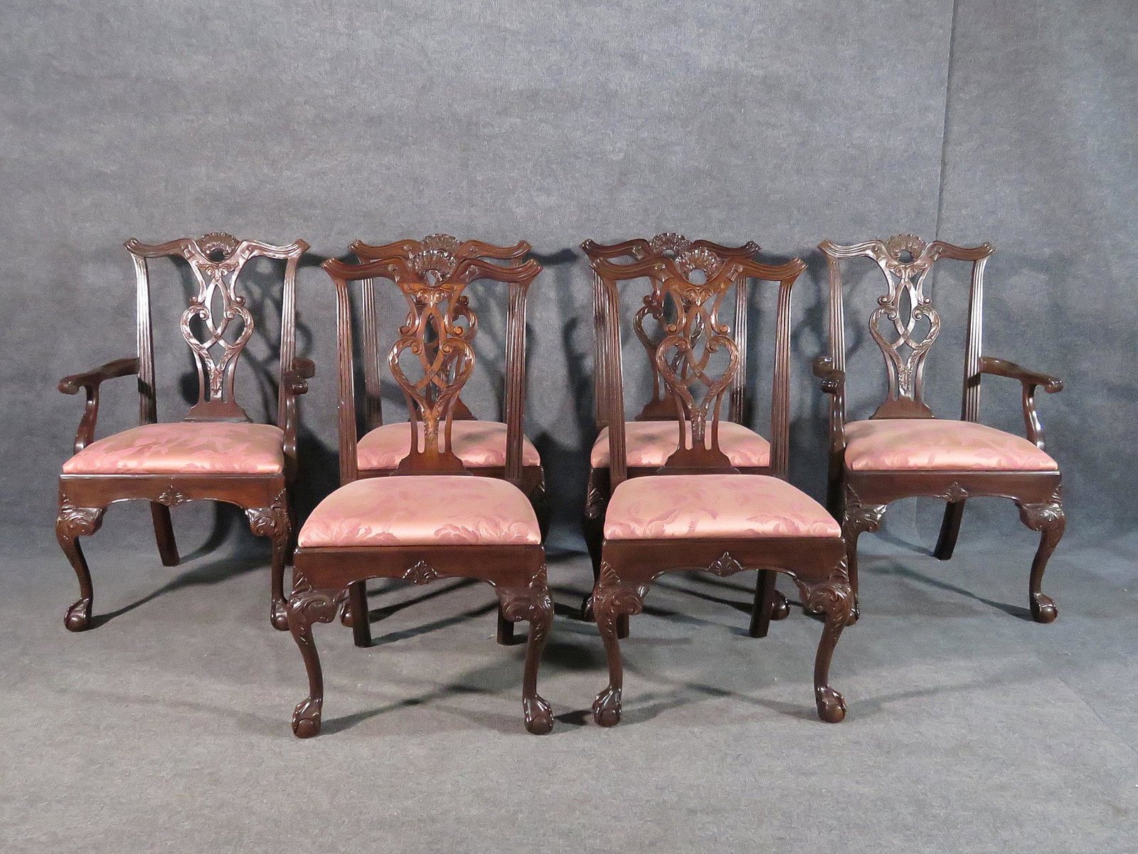 6 HENREDON DINING CHAIRS: Carved walnut. Upholstered seats. Claw feet. 40" h x 26" w x 24 1/2" d. Seat height 19 1/2" h. Side chairs measure 40" h x 22" w x 24 1/2" d. Seat height 19 1/2".