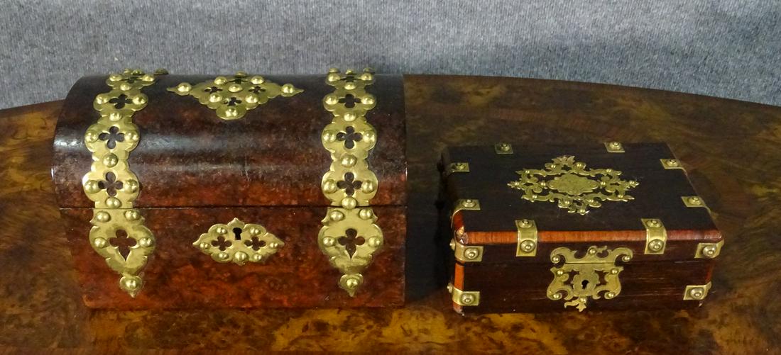 TWO ANTIQUE ENGLISH BOXES W METAL MOUNTS: Wood. Metal accents. Flip up lids. Lined interiors. One measures 2 1/2" h x 6 1/2" w x 4 1/2" d. Other measures 4 3/4" h x 7 7/8" w x 4 5/8" d. This one contains 2 wood lids revealing compartments.