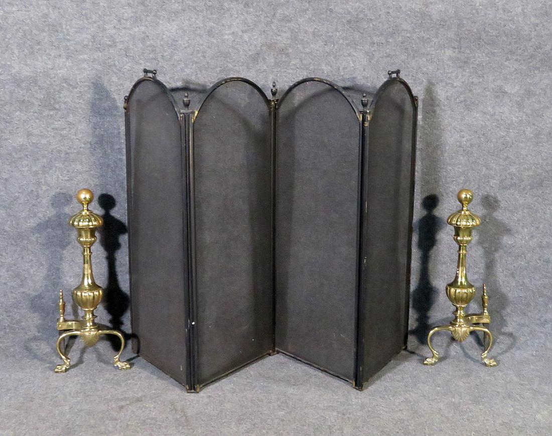 BRASS ANDIRONS AND BLACK FIRE SCREEN: Brass andirons. Fire screen measures 34" h x 14" w x 2" d. Andirons measure 21 1/2" h x 9" w x 8" d.
