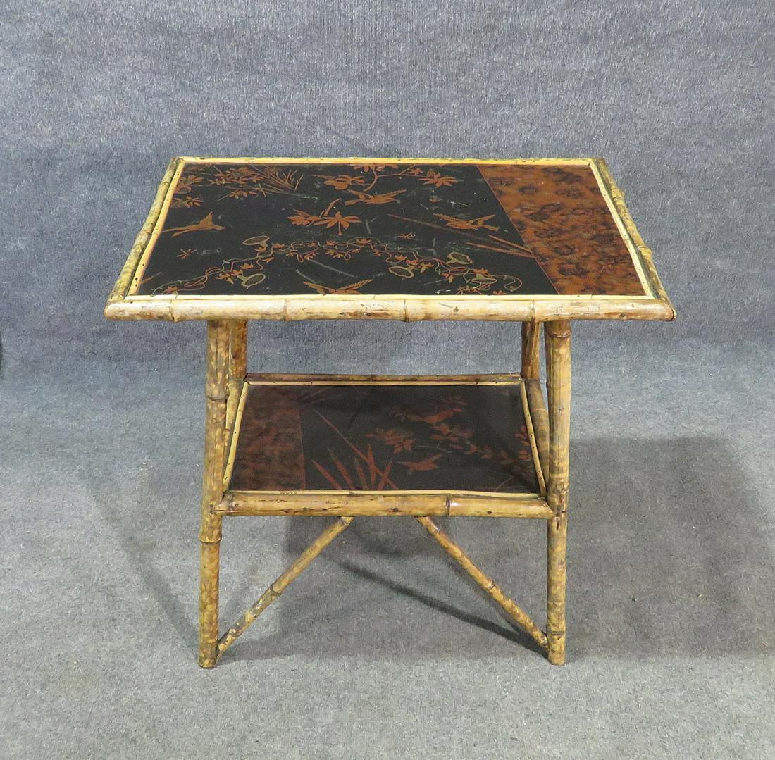 BAMBOO TABLE W CHINOISERIE INSERTS: 2 tier. Bamboo. Chinoiserie inserts. 28 1/2" h x 29 3/4" w x 22" d.
