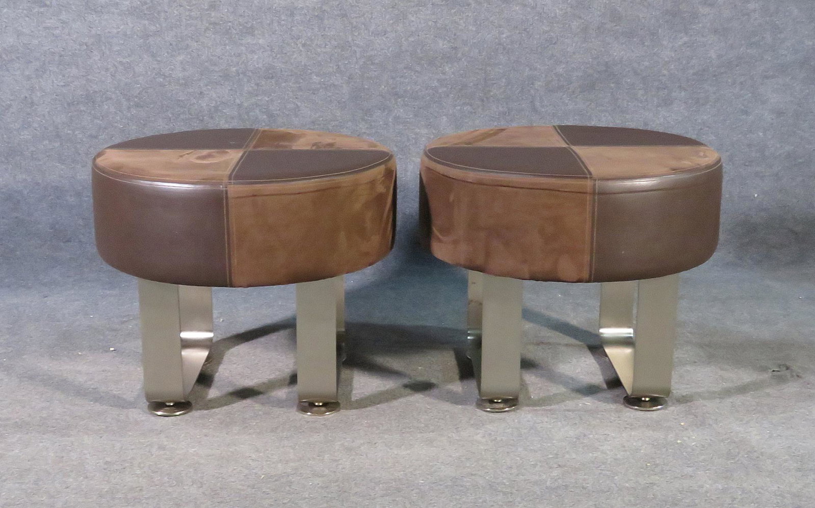 PR CONTEMPORARY ROUND BENCHES: Leatherette and suede upholstery. Steel legs. 19 3/4" h x 23 1/4" diameter.