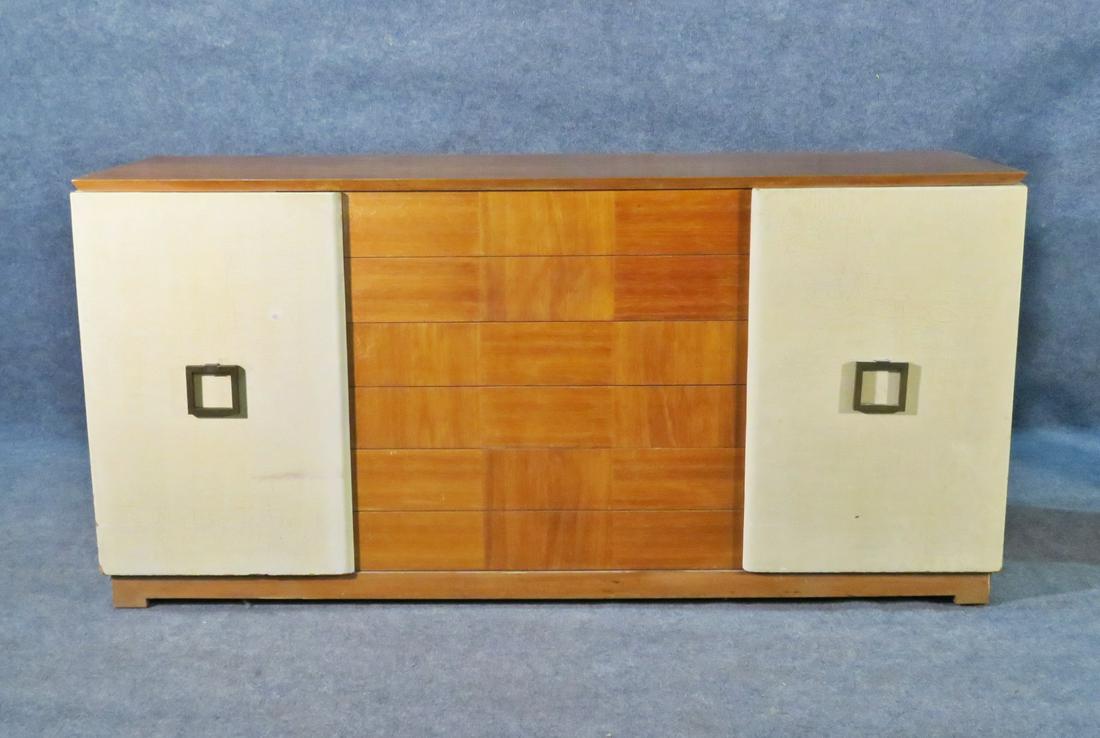 PAUL LASZLO DESIGN SIDEBOARD: Brass hardware. 2 doors containing 2 shelves. 6 dovetailed drawers. 35 1/4" h x 72 1/8" w x 21 1/8" d.