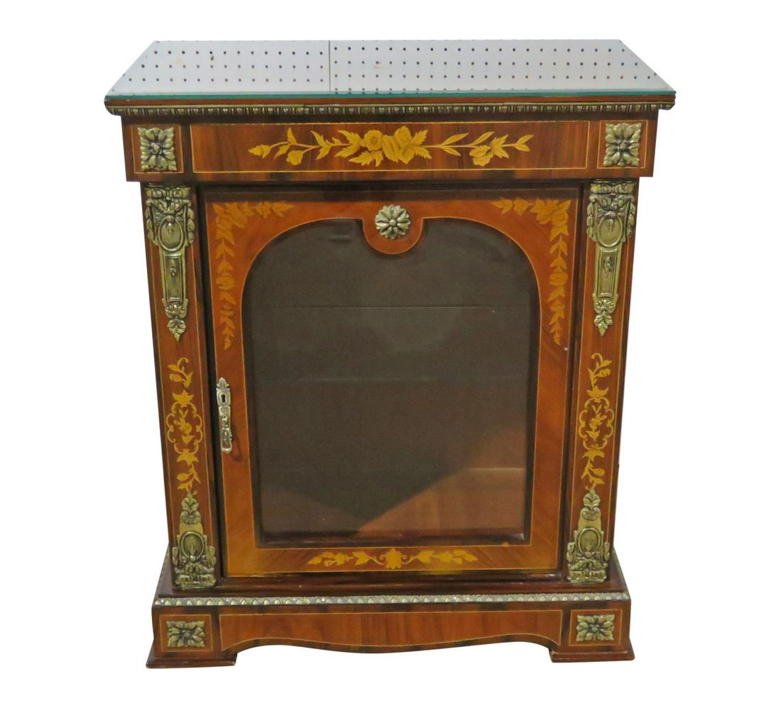 LOUIS PHILIPPE STYLE CREDENZA: One glass door containing one glass shelf. Inlaid. Brass accents. Beveled glass top. 37 3/8" h x 31 1/2" w x 17 1/4" d.