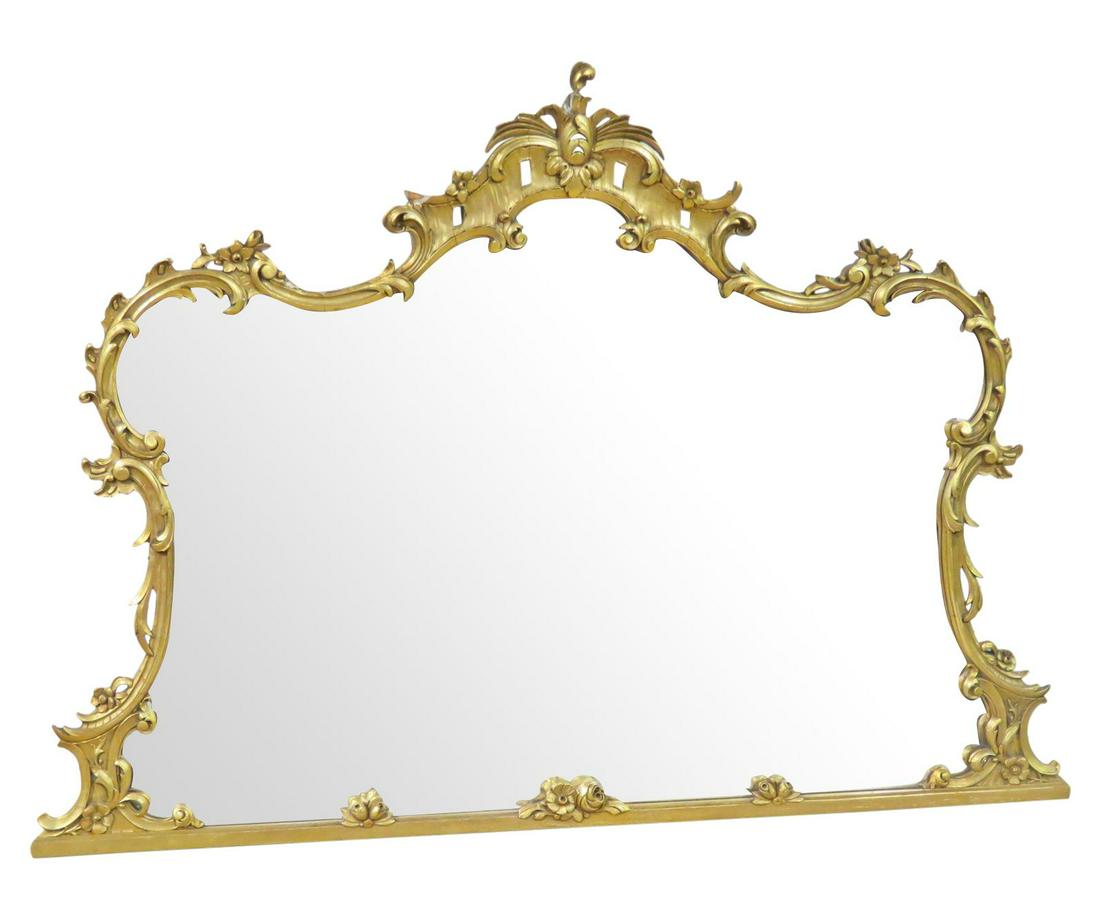 GILT BAROQUE CARVED MIRROR: Gilt carved. 42" h x 57 3/4" w x 3" d.
