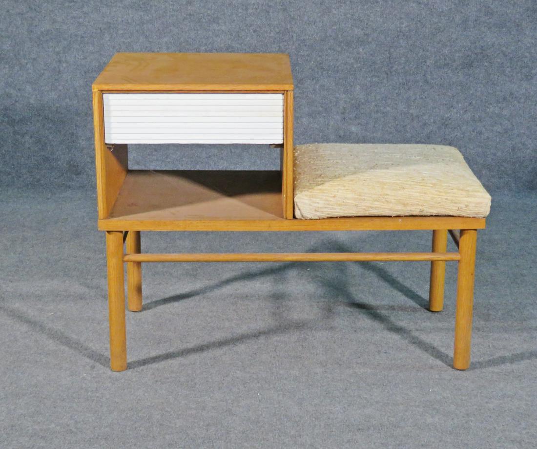 RAYMOND LOEWY TELPHONE BENCH: Walnut. One painted drawer. Upholstered seat. 27 1/8" h x 27 1/4" w x 17" d. Seat height 18 3/4".