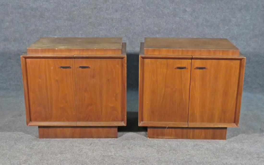 PAIR MID CENTURY MODERN NIGHT STANDS: Wood. Two doors containing one shelf. Metal hardware. 25" h x 26" w x 17 3/4" d.