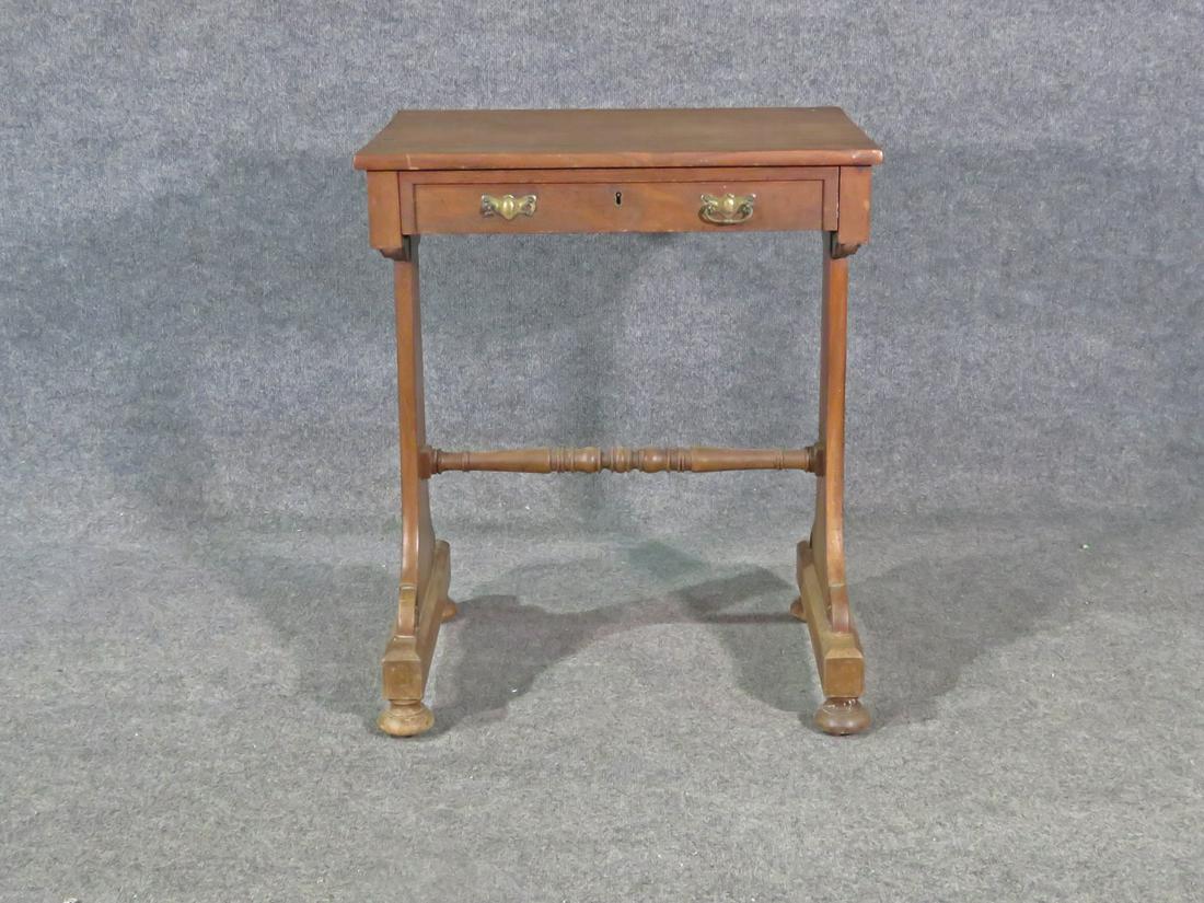 RARE LADIES WRITING DESK BY MACK WILLIAMS & GIBTON: Upholsterers and cabinet makers to His Majesty of Ireland. Stamped D8143. Circa 1810 - 1842. Wood On casters. One dovetailed drawer. Brass hardware. 29 1/8" h x 24" w x 17 7/8" d.