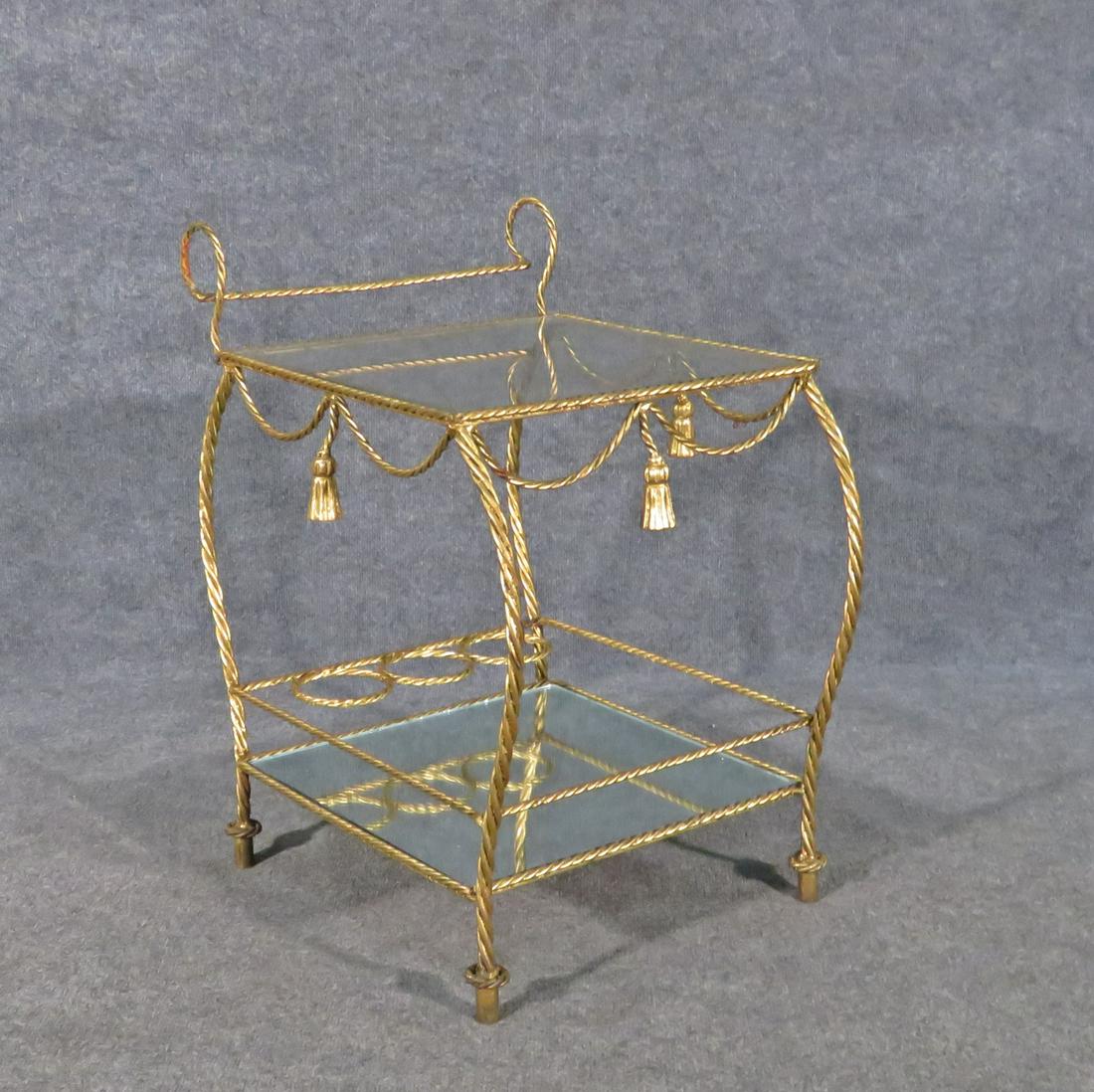 ITALIAN ROPE TWIST BAR CART: Gilded metal frame. One glass shelf. One mirrored shelf. 26 1/2" h x 18" w x 23" d.