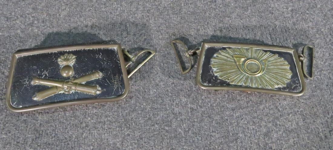 PAIR MILITARY AMMO BAGS: Bronze accents. Leather. One measures 3 3/4" h x 6 7/8" h x 2" d. Other measures 3 1/4" h x 6 1/4" w x 1 3/8" d.