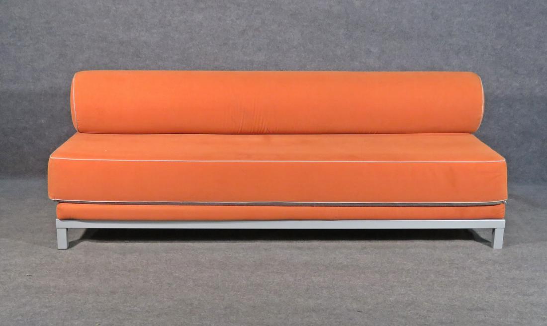 DANISH MECHANICAL SOFA/DAYBED: Made in Demark. Metal frame. Orange upholstery. 28 1/4" h x 79" w x 34 1/4" d. Seat height 16".