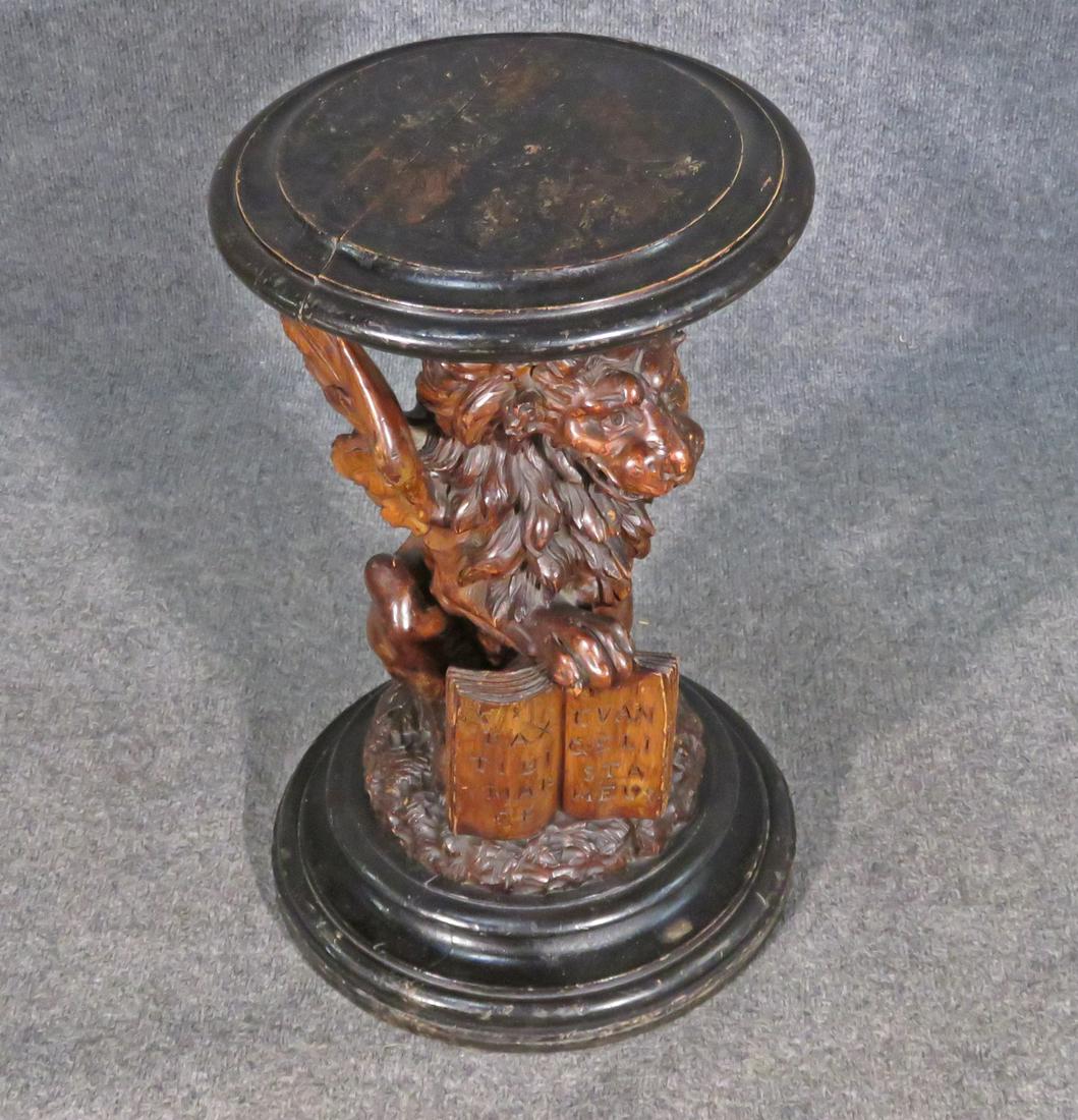 CARVED GRIFFIN FIGURAL PEDESTAL: Wood. Ebonized. Griffin figural. 21 1/8" h x 12 1/4" diameter.