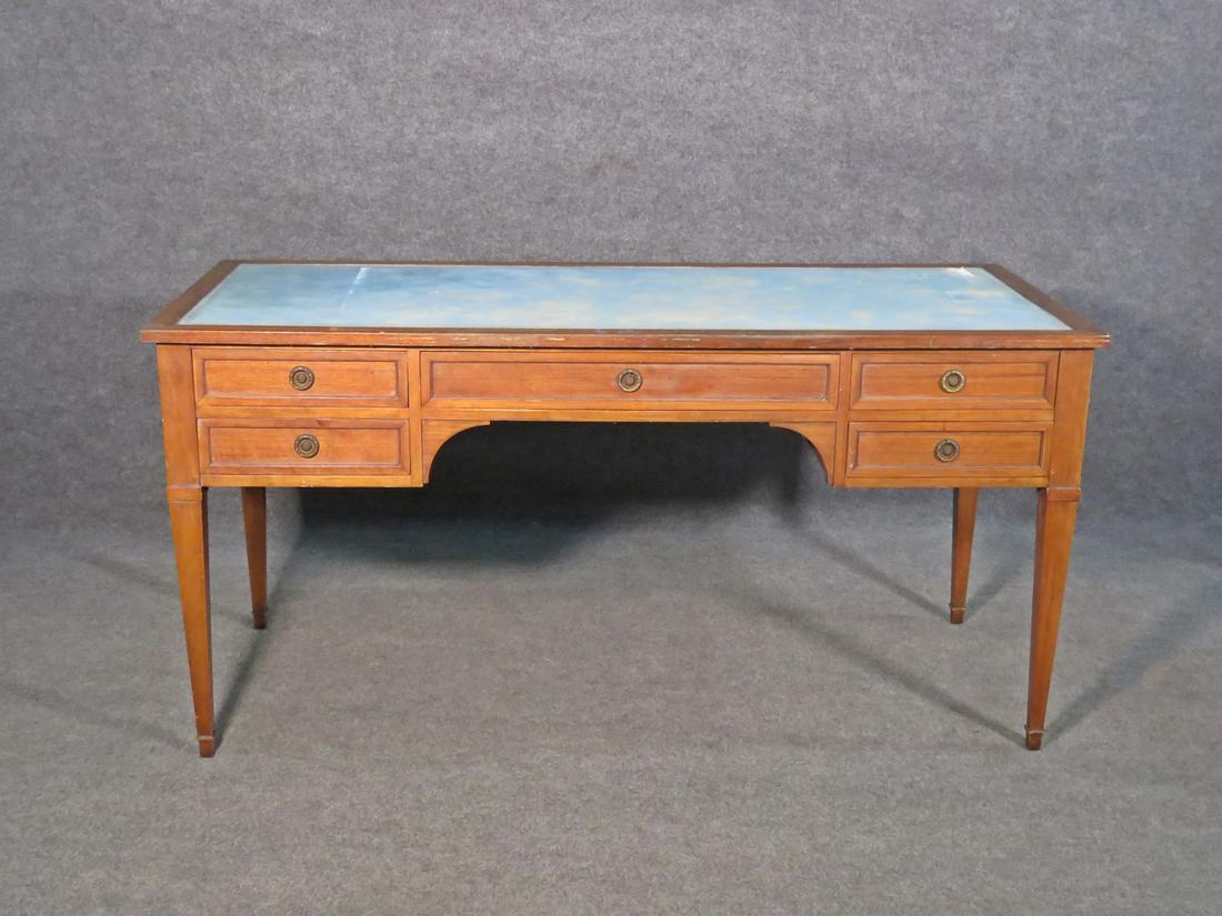 DIRECTOIRE LEATHER TOP WRITING DESK: 5 drawers. Brass hardware. Leather top. 29 3/4" h x 60" w x 26" d.