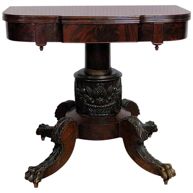 ANTIQUE DUNCAN PHYFE CARD TABLE: Antique. 1820's. Mahogany. Carved paw foot. Flip to. On casters. 31 3/4" h x 36" w x 19 1/4" d.