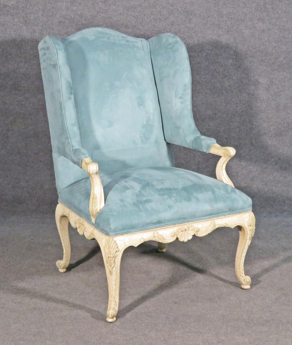 LOUIS XV STYLE CARVED WING CHAIR: Carved wood frame. Upholstered. 42 1/2" h x 27 3/4" w x 33" d. Seat height 18 1/2".
