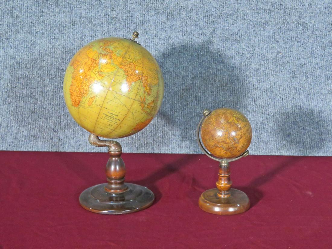 COMPANION PAIR 19TH C GLOBES: Walnut bases. Large one measures 10 1/2" h x 6" w x 6" d. Small one measures 6" h x 3 1/2" w x 3 1/2" d.