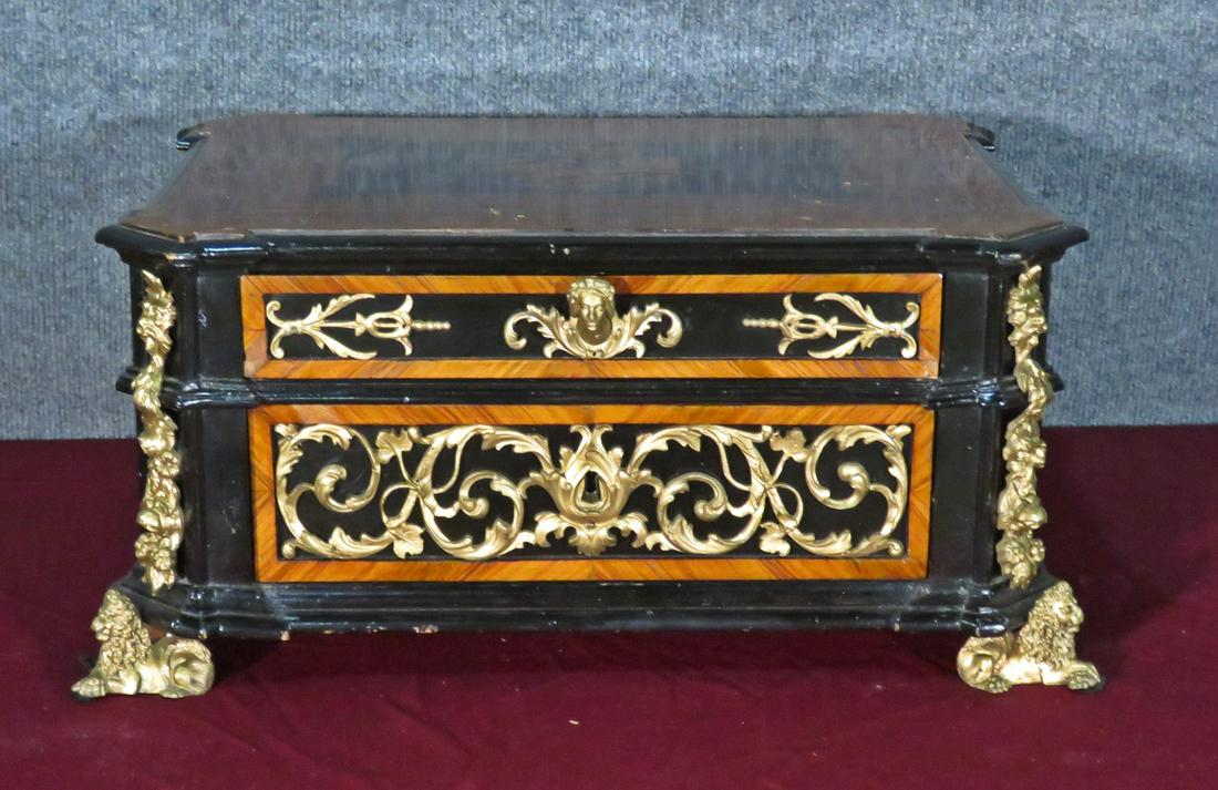 EBONIZED RENAISSANCE INLAID JEWELRY CASKET: Austrian. Bronze mounted. Figural with flowers and lions. Inlaid. 2 drawers. 9" h x 19" w x 14 1/2" d.