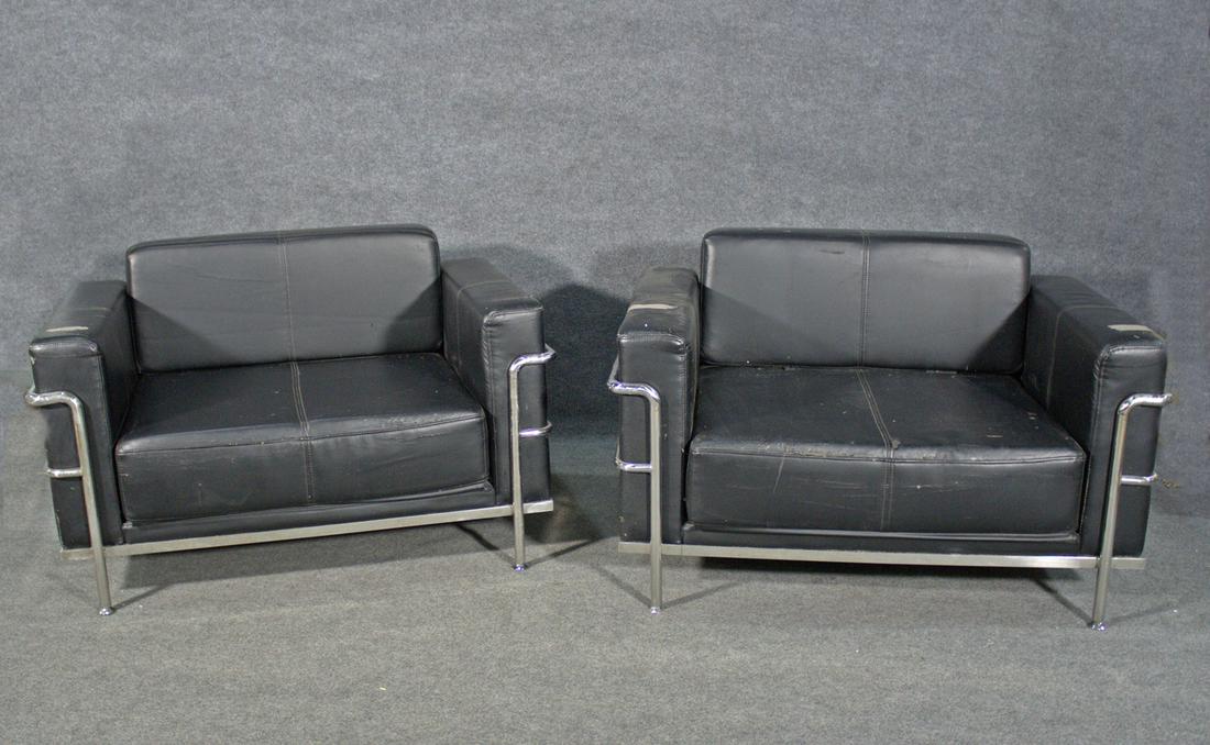 PAIR CASSINA STYLE CHAIRS: Chrome frames. Vinyl upholstery. 29 1/2" h x 46 1/2" w x 32" d. Seat height 16 1/2".
