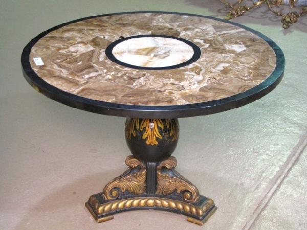 ITALIAN STYLE PEDESTAL TABLE w/ TASSELATED ONYX TO: Ebonized and gilt wood base. Very good condition. 26"h. x 38" diameter.