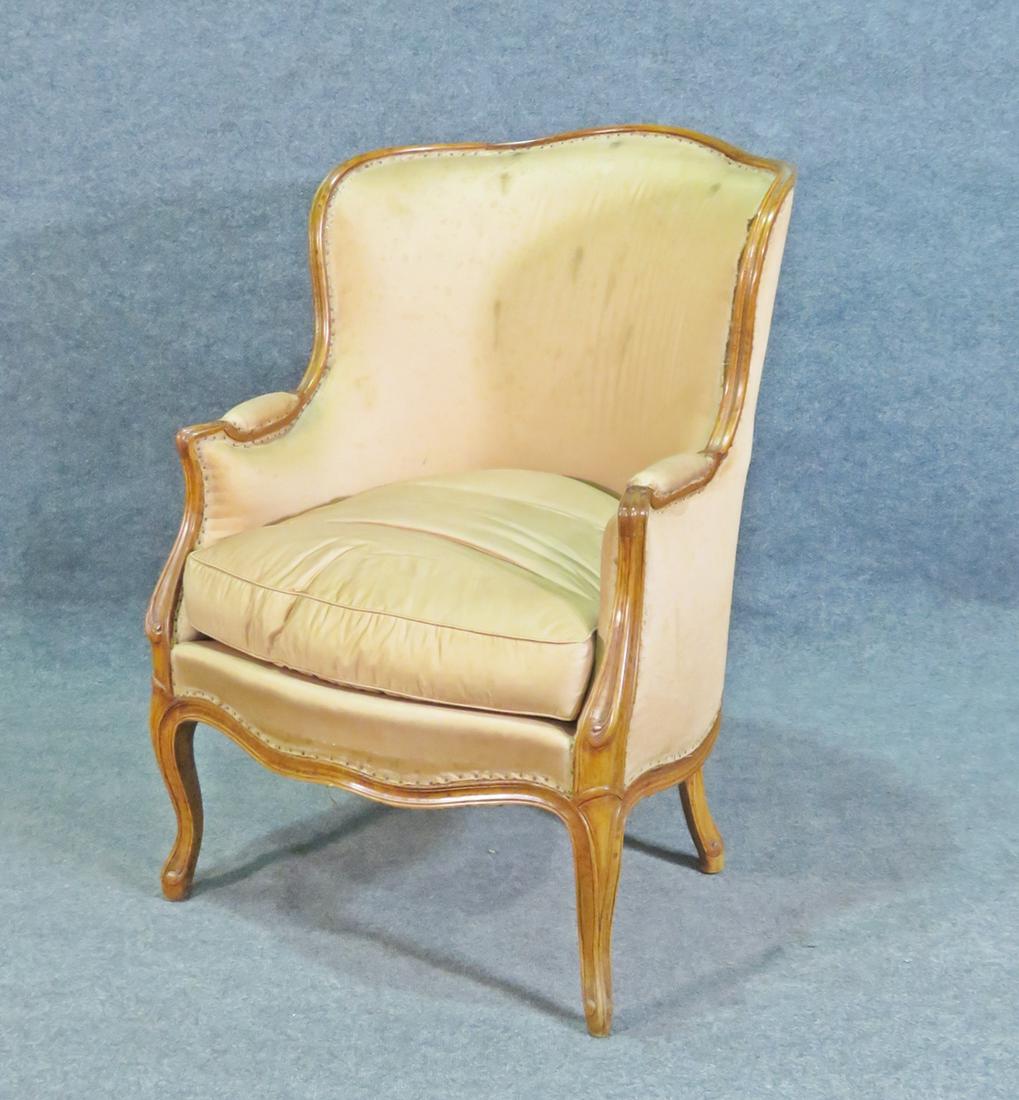 LOUIS XV STYLE BERGERE: Walnut frame. Upholstered. 37 5/8" h x 26 3/8" w x 21"d. Seat height 21".
