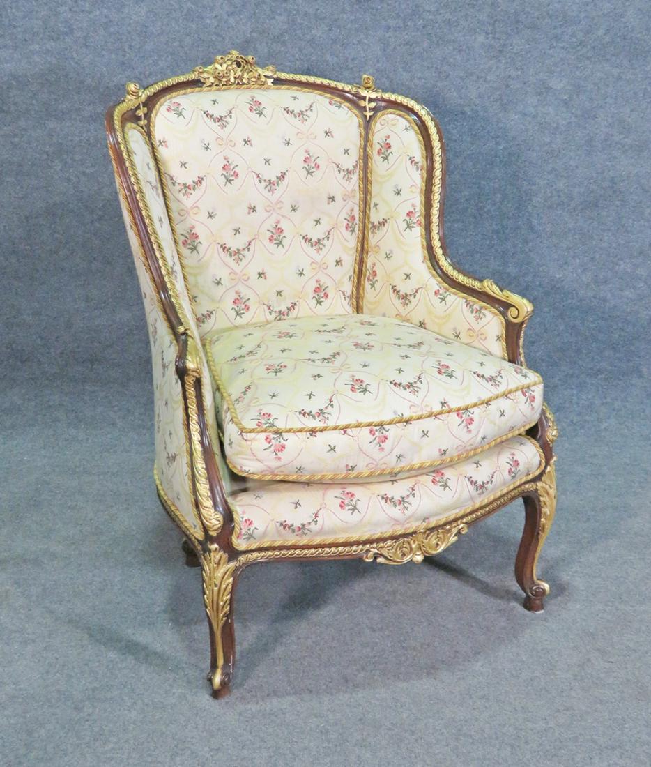 LOUIS XV STYLE ANTIQUE BERGERE: Floral upholstery. Gilt accent. French. 40" h x 28 1/4" w x 19 5/8" d. Seat height 22".
