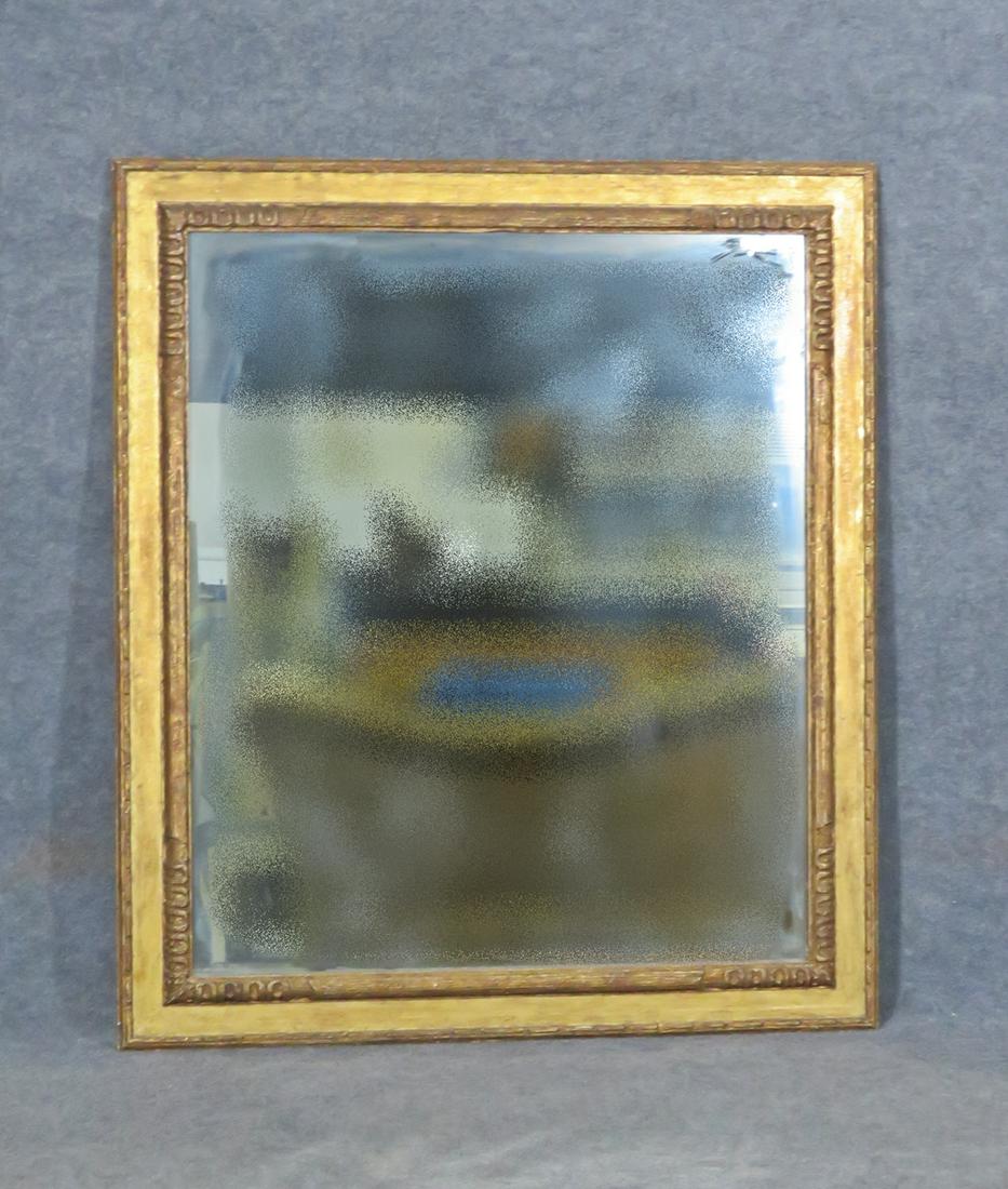 ANTIQUE GILT WOOD MIRROR: Gilt. 47 3/4" h x 41 1/2" x 1 3/4" d.