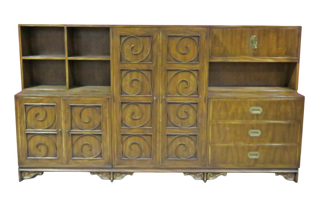 MASTERCRAFT CAMPAIGN STYLE 7 PC DRESSER: Walnut. Brass accents. Dovetail drawers. Left has 4 shelves on top. 2 doors containing shelf at bottom. Middle has 2 doors containing 1 shelf and 5 drawers. Right has 2 doors containing 1 shelf on top