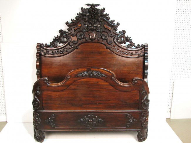 VICTORIAN ROSEWOOD CARVED HIGHBACK BED: Exceptional quality. No maker's mark. Probably Baltimore. Very good condition. 69" headboard. Interior measurement 73" x 56". From the estate of former Ambassador to Argentina James Bruce.