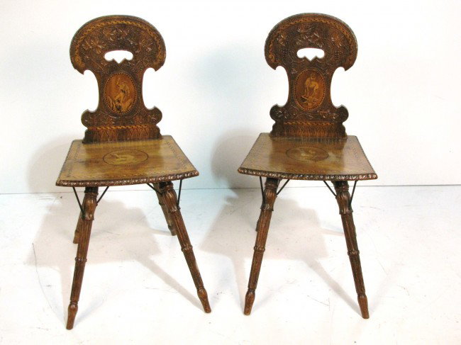 Pr. 19th c. GERMAN BLACK FOREST SIDE CHAIRS: Carved and inlaid. Very good condition. 33"h. x 16 1/2"w. x 14"d. From the estate of former Ambassador to Argentina James Bruce.