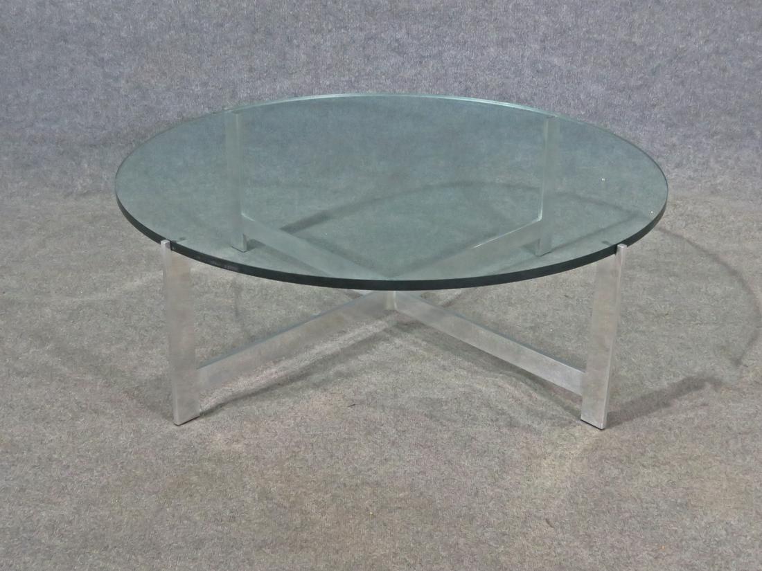 MILO BAUGHMAN STYLE ALUMINUM & GLASSTOP TABLE: Aluminum frame. Glass top. 14 3/4" h x 44" diameter.