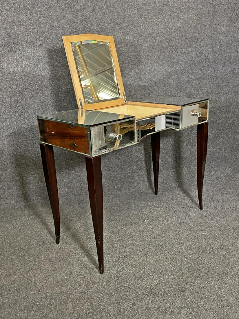 DECO MIRRORED VANITY: Mirrored top. Wood legs. Opens to mirror. Center glass is etched. 28 1/8" h x 35 1/4" w x 17" d.