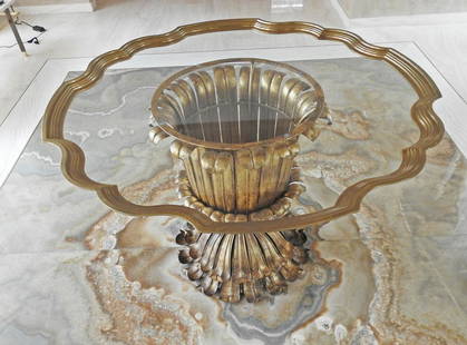 ITALIAN CENTER TABLE: Gilt steel. Glass. Rim brass. Circa 1960's. 29" h x 42" diameter.