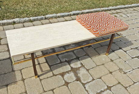 HARVEY PROBBER COFFEE TABLE: Travertine top. Brass accents. Mahogany. Circa 1960's. 15" h x 54" w x 18" d. Cushion 20" square x 2 1/2" d.